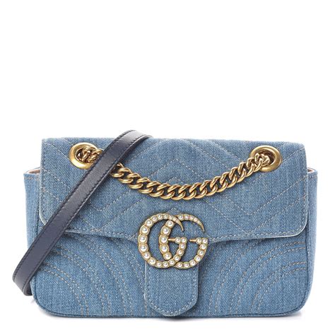 gucci handbag with blue jean patch work and crocodile pattern